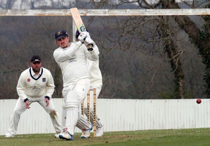 James Phillips smashes the ball to the boundary for Lawrenny. Picture by Susan McKehon